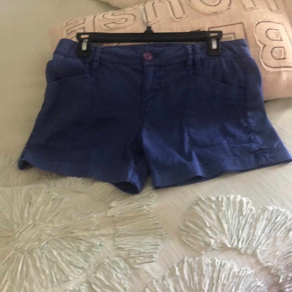 Level 99 cute blue shorts with front and back pockets.  Size 27